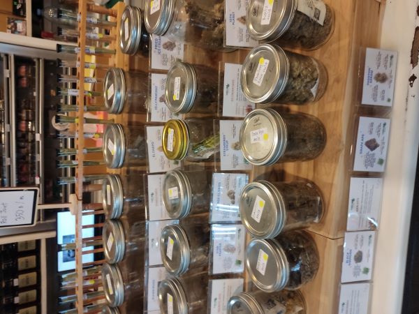 Cannabis strains displayed in glass jars in Thailand